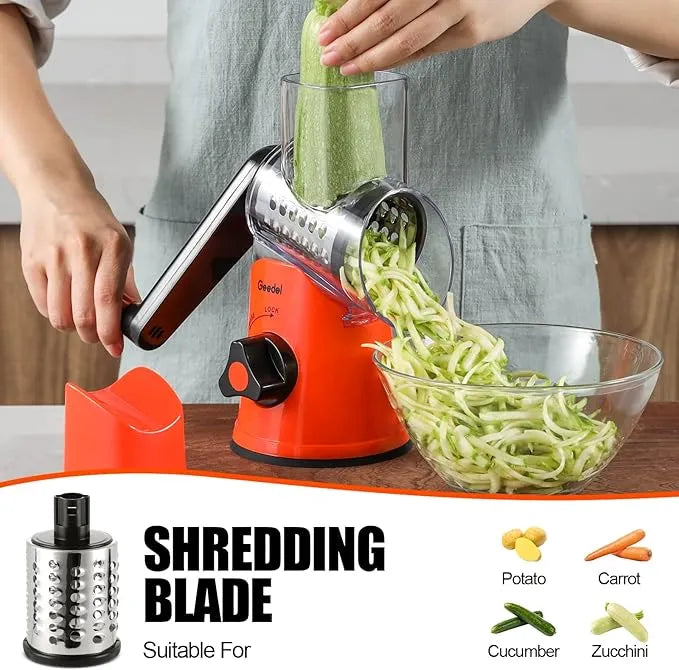Orange and black Geedel rotary cheese grater using the coarse shredding blade for cheese, carrots, and toppings.