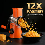 A product shot of the Geedel suction-base rotary grater, demonstrating high-speed shredding of cheddar cheese.